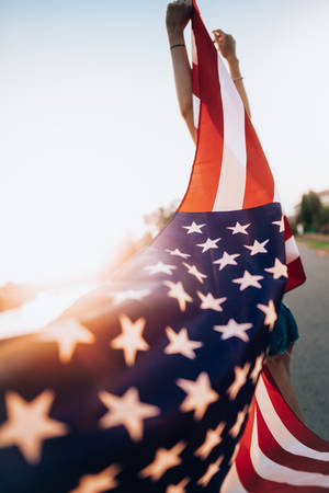 Person Waves American Flag Iphone Wallpaper