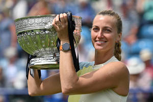 Petra Kvitova Holding Huge Trophy Wallpaper