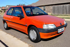 Peugeot106 Orange Hatchback Wallpaper