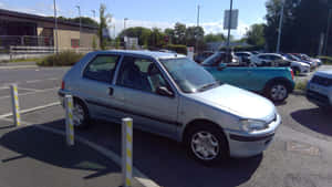 Peugeot106 Silver Hatchback Parking Lot Wallpaper