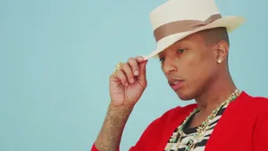 Pharrell Williams Stylish Hat Pose Wallpaper