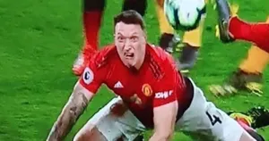 Phil Jones In Action On The Football Field Wallpaper