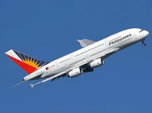 Philippine Airlines Plane In Clear Blue Sky Wallpaper