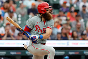 Phillies Player Swinging Bat Action Shot Wallpaper