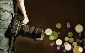 Photographer Holding Camera Bokeh Background Wallpaper