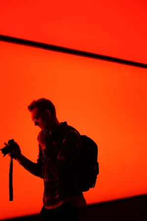 Photographer In Red Backdrop.jpg Wallpaper