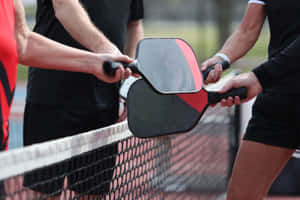 Pickleball Paddle Tap Over Net Wallpaper