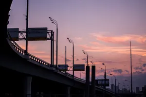 Picture Perfect - Perfect View Of The Skyway Bridge With Glowing Lights At Dusk. Wallpaper