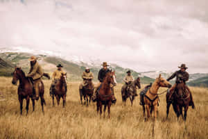 Picture Perfect Scenery Of A Ranch Near The Mountains Wallpaper