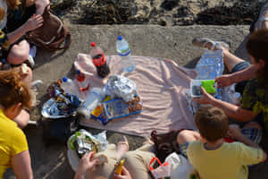 Picturesque Beach Picnic Setup Wallpaper