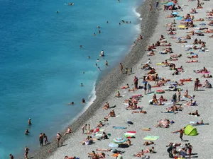 Picturesque French Beach On A Sunny Day Wallpaper