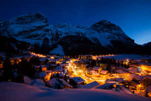 Picturesque Snowy Village In Winter Wallpaper