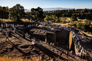 Pilgrims Around St. George Church In Lalibela Wallpaper