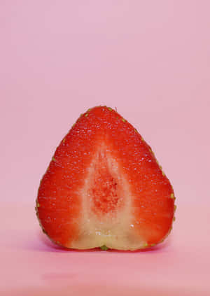 Pink Background Half Strawberry Wallpaper