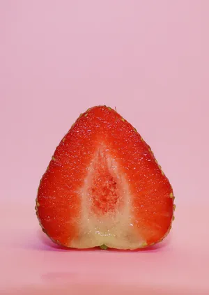 Pink Background Half Strawberry Wallpaper