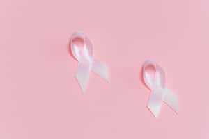 Pink Background White Awareness Ribbons Wallpaper