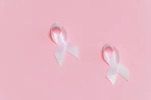 Pink Background White Awareness Ribbons Wallpaper