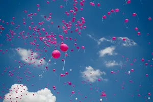 Pink Balloons In Cloudy Sky Wallpaper