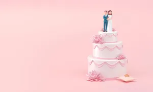 Pink Bride And Groom Topped Wedding Cake Wallpaper