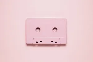 Pink Cassette Tapeon Pastel Background Wallpaper