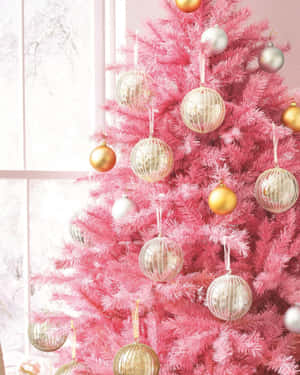 Pink Christmas Tree With Gold Ornaments Wallpaper