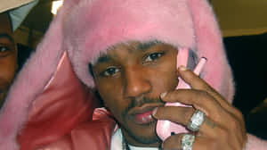 Pink_ Fur_ Hat_and_ Phone_ Man Wallpaper