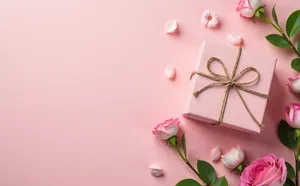 Pink Gift Box With Ribbon And Floral Decor Wallpaper