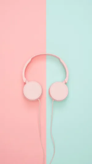 Pink Headphones On A Pink And Blue Background Wallpaper