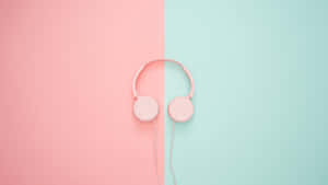 Pink Headphones On A Pink And Blue Background Wallpaper