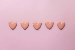 Pink Heartson Pastel Background Wallpaper