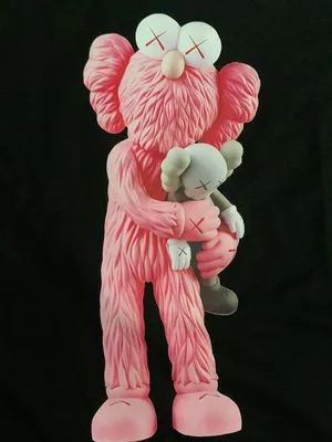 Pink Kaws Figure Holding Smaller Companion Wallpaper