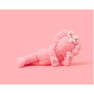 Pink Kaws Figure Lying Down Wallpaper