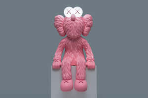 Pink Kaws Figure Sitting Wallpaper