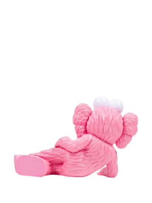 Pink Kaws Figure Sitting Down Wallpaper