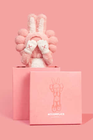 Pink Kaws Figurewith Box Wallpaper