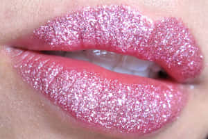 Pink Lipstick On A Shimmering Background Wallpaper