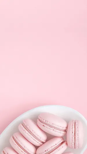 Pink Macarons On A Plate On A Pink Background Wallpaper