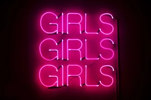Pink Neon Girls Sign Wallpaper