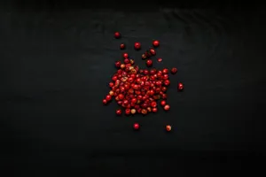Pink Peppercorn Cluster On Branch Wallpaper