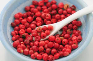 Pink Peppercorns On A Wooden Spoon Wallpaper