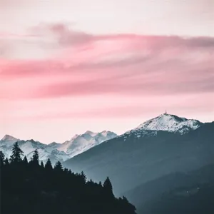 Pink_ Sunset_ Over_ Snowy_ Mountain_ Peaks Wallpaper