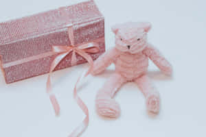 Pink Teddy Bearand Gift Boxwith Bow Wallpaper