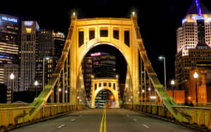 Pittsburgh Skyline On Robert Clemente Bridge Wallpaper