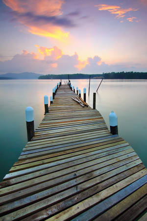 Pixel 4 Brown Wooden Dock On Lake Wallpaper