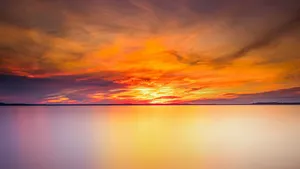Placid Ocean On A Sunset Wallpaper