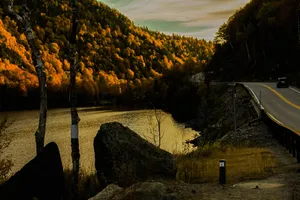 Placid Road Along A Lake Wallpaper