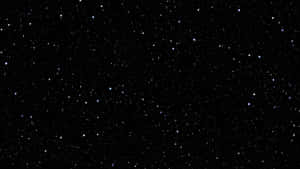 Plain Black Desktop With Twinkling Stars Wallpaper