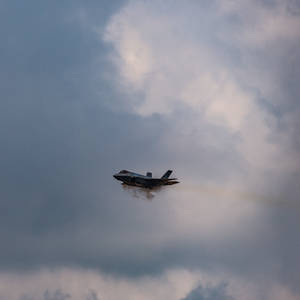 Plane Entering Cloud Cover Wallpaper