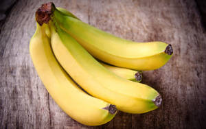 Plantain On Wood Table Wallpaper