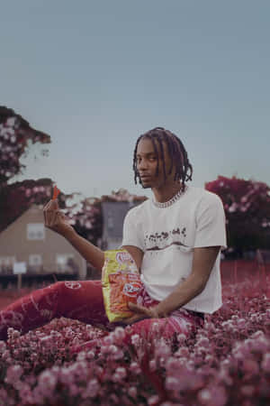 Playboi Carti In Flower Fields Aesthetic Rapper Wallpaper